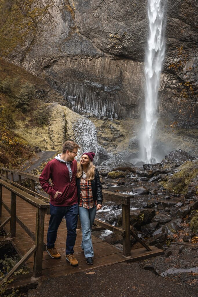 Couple hiking by Latourell Falls