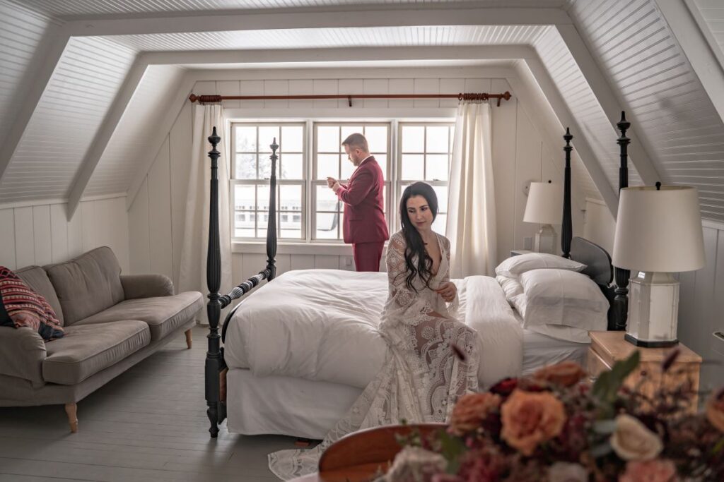 couple getting ready for winter wedding in an Oregon cabin